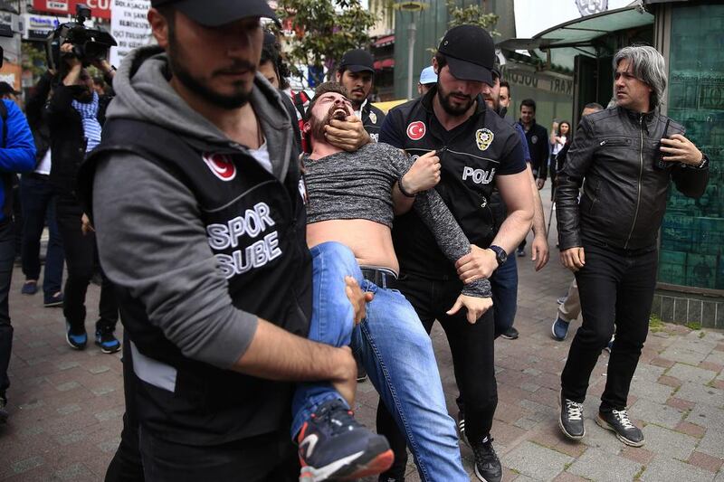 Police arrest a demonstrator during a May Day protest in Istanbul, Turkey. Lefteris Pitarakis / AP Photo