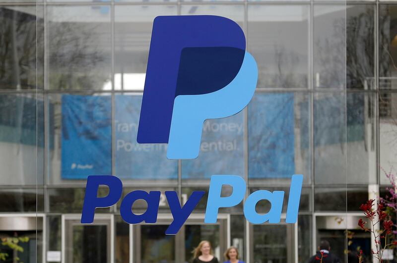 FILE - This March 10, 2015, file photo, shows signage outside PayPal headquarters in San Jose, Calif. PayPal Holdings, Inc. reports earnings Wednesday, July 26, 2017. (AP Photo/Jeff Chiu, File)