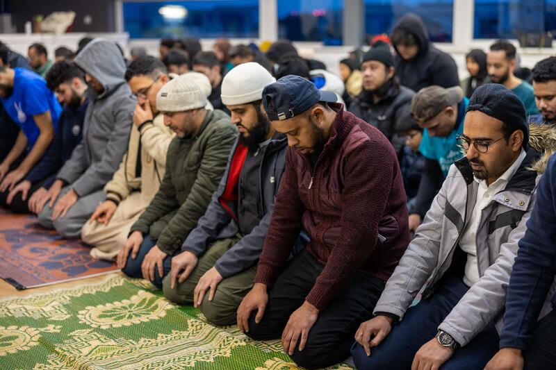 Muslim worshippers pray at the stadium 