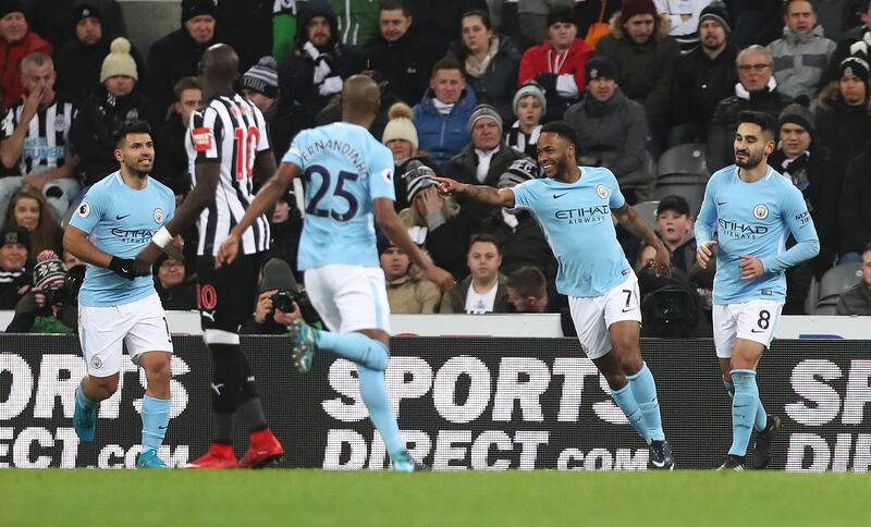 NEWCASTLE UPON TYNE, ENGLAND - DECEMBER 27:  Raheem Sterling of Manchester City celebrates scoring the opening goal with team mates during the Premier League match between Newcastle United and Manchester City at St. James' Park on December 27, 2017 in Newcastle upon Tyne, England.  (Photo by Ian MacNicol/Getty Images)