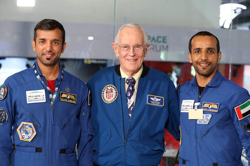 Apollo 16 astronaut Charles Duke in conversation with UAE astronauts Hazza Al Mansouri (R) and Sultan Al Neyadi on the second day of the Dubai airshow 2021. Chris Whiteoak/ The National