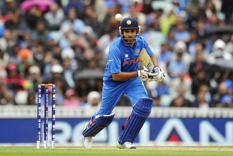 India's Rohit Sharma plays a shot during the 2013 ICC Champions Trophy One Day International (ODI) cricket match between India and West Indies at The Oval in London, England on June 11, 2013.   Ravindra Jadeja picked up a career-best 5-36 as India kept the West Indies down to 233-9 in a key Champions Trophy match at the Oval.  AFP PHOTO/GLYN KIRK - RESTRICTED TO EDITORIAL USE
 *** Local Caption ***  318366-01-08.jpg