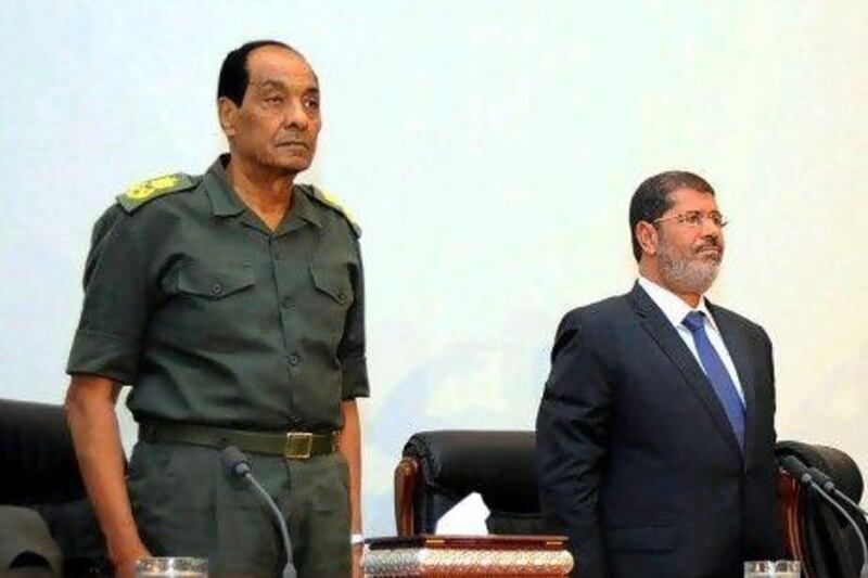 Egypt’s president Mohammed Morsi (right) and Egyptian Military Council chief Field Marshal Mohammed Hussein Tantawi. Many say Morsi’s new cabinet was aimed at avoiding any row that might detract from undoing what Islamists say is an excessive concentration of power in the military.