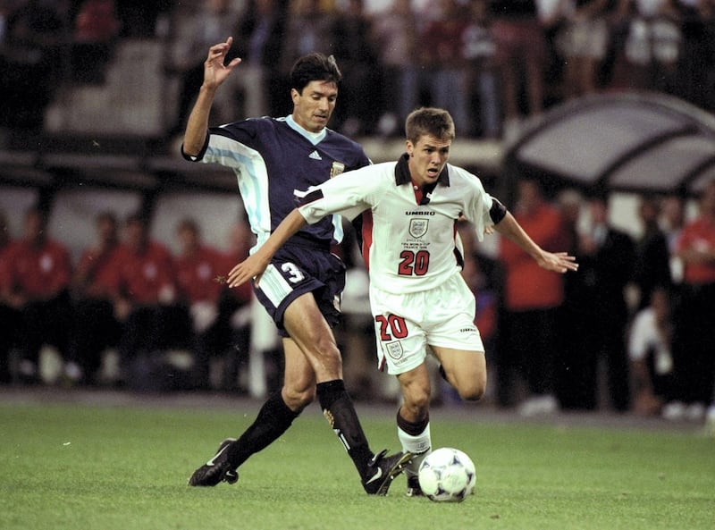 30 Jun 1998:  Michael Owen of England in action against Jose Chamet of Argentina during the 1998 World Cup match against Argentina played in St Etienne, France.  The match finished in a 2-2 draw after extra-time and in a dramatic twist England once againlost in the penalty shoot-out 4-3. \ Mandatory Credit: Ross Kinnaird /Allsport