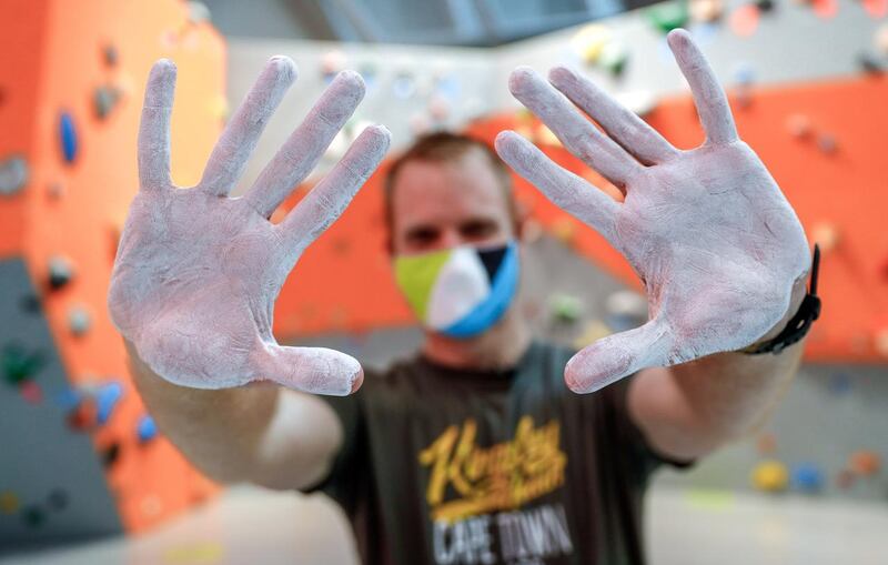 Abu Dhabi, United Arab Emirates, August 20, 2020.   Jason Von Berg of The National puts on liquid chalk which is Covid-19 safe before he goes up the wall at Cymb Abu Dhabi.
Victor Besa /The National
Section:  NA
Reporter:  Jason Von Berg