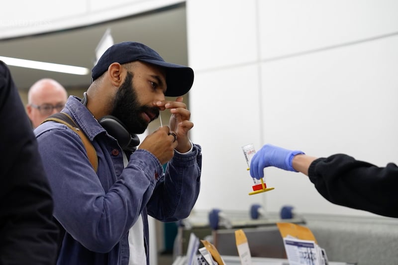 A person takes a Covid test at Newark Liberty International Airport in New Jersey. AP