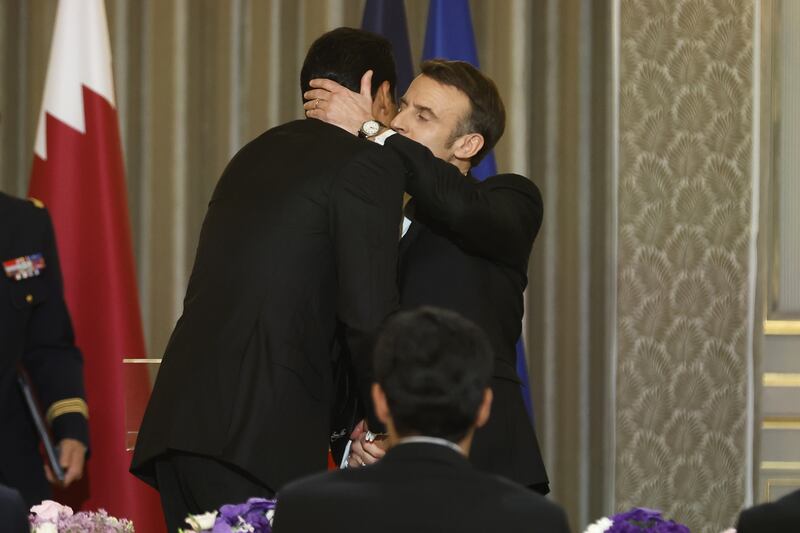Mr Macron and Sheikh Tamim. EPA