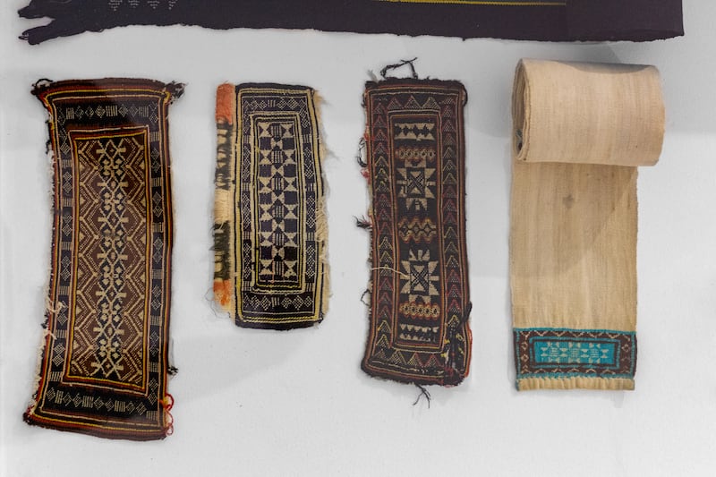 The works span a variety of mediums, exploring the textile's relationship with Malagasy life and culture. Pictured are an array of salaka decorations, depicting the many designs lamba might take