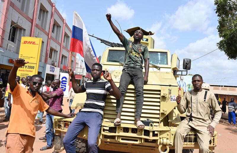 Protesters demonstrate against France and the Economic Community of West African States (Ecowas) whose representatives are expected in Ouagadougou, Burkina Faso. West African envoys have arrived on a fact-finding mission after the country's second coup in fewer than nine months. AFP
