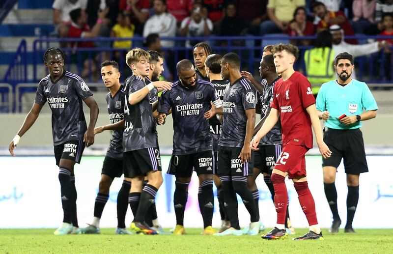 Soccer Football - Friendly - Liverpool v Olympique Lyonnais - Al Maktoum Stadium, Dubai, United Arab Emirates - December 11, 2022 Olympique Lyonnais' Alexandre Lacazette celebrates scoring their third goal with teammates REUTERS / Satish Kumar