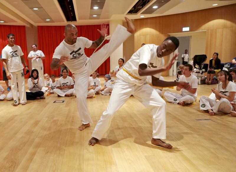 Members of Capoeira Abu Dhabi hold a batizado, a graduation ceremony, during May’s first biannual Capoiera Brazil festival at New York University in Abu Dhabi. Christopher Pike / The National