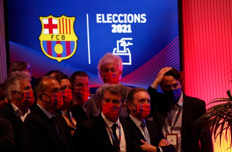 Newly elected FC Barcelona president Joan Laporta and his staff before the press conference. Reuters