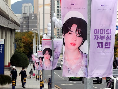 Banners featuring BTS member Jimin are displayed along a road near Busan Asiad Main Stadium in Busan, South Korea. AP
