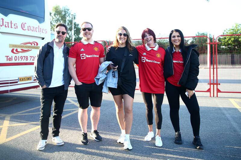 Manchester United fans leave Old Trafford by bus to travel to Wembley. PA