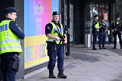 Armed police patrol outside the Eurovision venue in Malmo. EPA