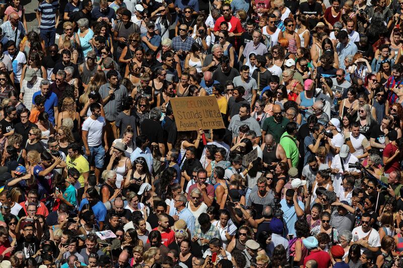 People march down Las Ramblas the day after a van crashed into pedestrians in Barcelona, Spain. Sergio Perez / Reuters.