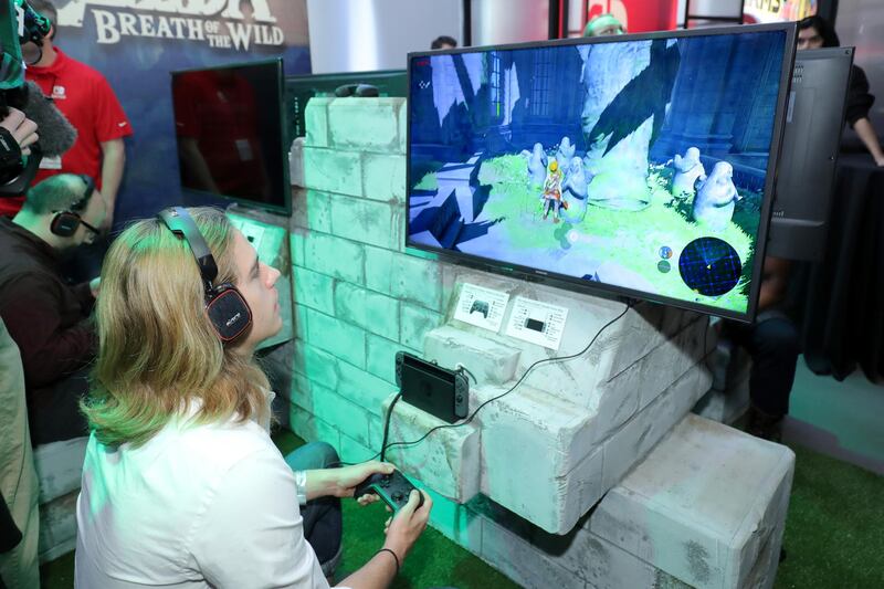 NEW YORK, NY - JANUARY 13: In this photo provided by Nintendo of America, A guest enjoys playing The Legend of Zelda: Breath of the Wild on the groundbreaking new Nintendo Switch at a special preview event in New York on Jan. 13, 2017. Launching in March 3, 2017, Nintendo Switch combines the power of a home console with the mobility of a handheld. It's a new era in gaming that delivers entirely new ways to play wherever and whenever people want.   Neilson Barnard/Getty Images for Nintendo of America/AFP