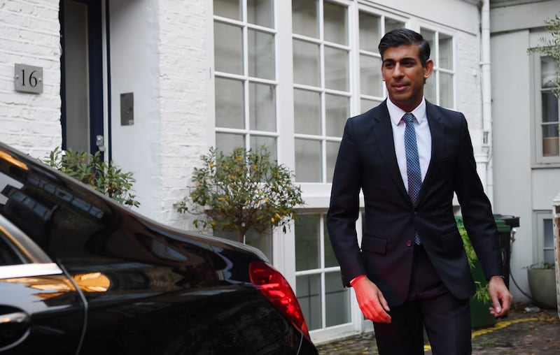 Rishi Sunak leaves his home in London. EPA