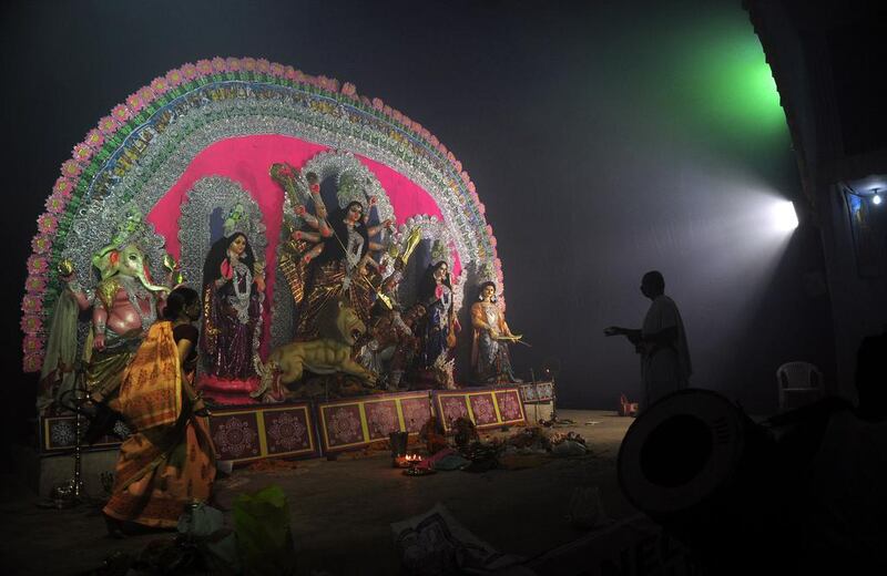A priest performs rituals during the Hindu festival Durga Puja in Allahabad.  Sanjay Kanojia / AFP