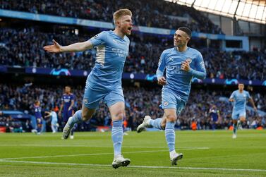 Soccer Football - Champions League - Semi Final - First Leg - Manchester City v Real Madrid - Etihad Stadium, Manchester, Britain - April 26, 2022 Manchester City's Kevin De Bruyne celebrates scoring their first goal with Phil Foden REUTERS / Craig Brough     TPX IMAGES OF THE DAY
