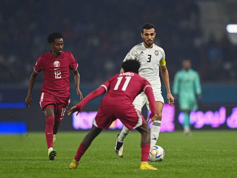 UAE's Walid Abbas fights for the ball against Qatar. Photo: UAE FA