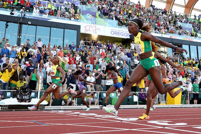 Shelly-Ann Fraser-Pryce crosses the finish line to win gold ahead of silver medalist Shericka Jackson and bronze medalist Elaine Thompson-Herah. Getty