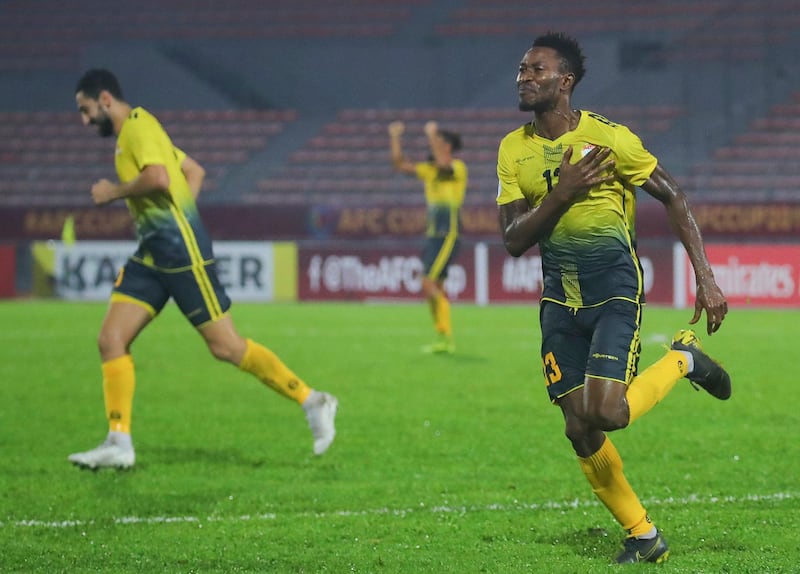 Issah Yakubu (R) of Al Ahed Football Club of Lebanon  celebrates after scoring the winning goal during  the AFC Cup Final in Kuala Lumpur. EPA