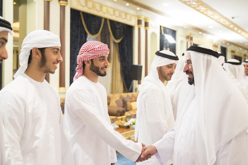 Sheikh Zayed bin Hazza bin Zayed Al Nahyan, second left, greets Dr Sheikh Sultan bin Mohammed Al Qasimi, Ruler of Sharjah, right. Mohamed Al Hammadi / Crown Prince Court - Abu Dhabi