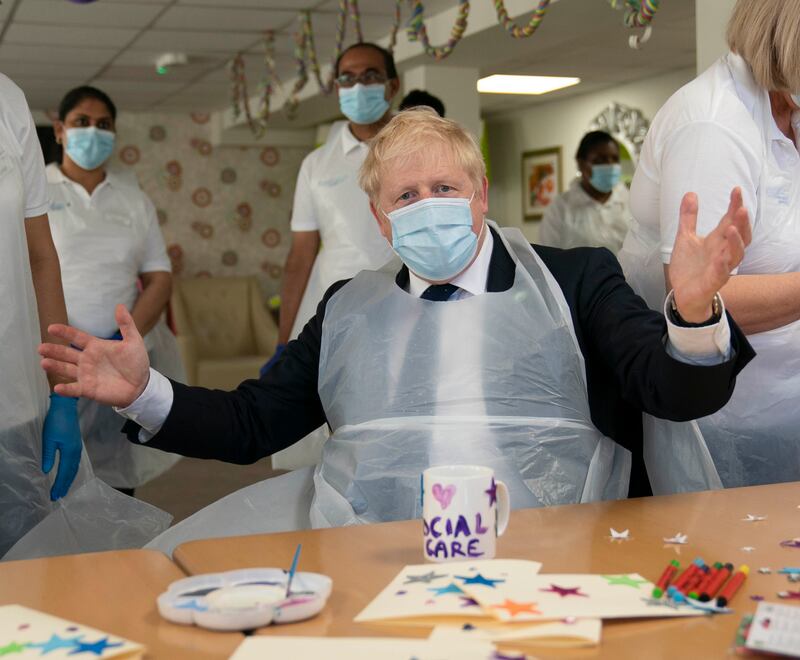 Boris Johnson during a visit to Westport Care Home in Stepney Green, ahead of unveiling his long-awaited plan to fix the social care system, in September 2021. Getty Images