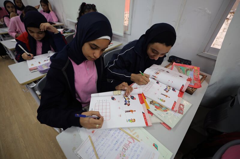 Egyptian pupils attend a Chinese language class at the Martyr Ahmed Mahmoud Mustafa school in Giza. EPA