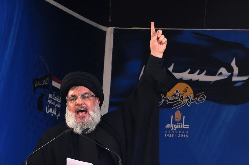 (FILES) In this file photo taken on October 12, 2016 Lebanon's Shiite movement Hezbollah's leader Hassan Nasrallah addresses a crowd during commemorations for Ashura in a southern Beirut suburb. - In a televised speech on August 14, on the occasion of the 12th anniversary marking the end of the July-August 2006 war between his movement and the Israeli army, Nasrallah said "Israel has the nerve to impose conditions regardless of its defeated in Syria". (Photo by PATRICK BAZ / AFP)