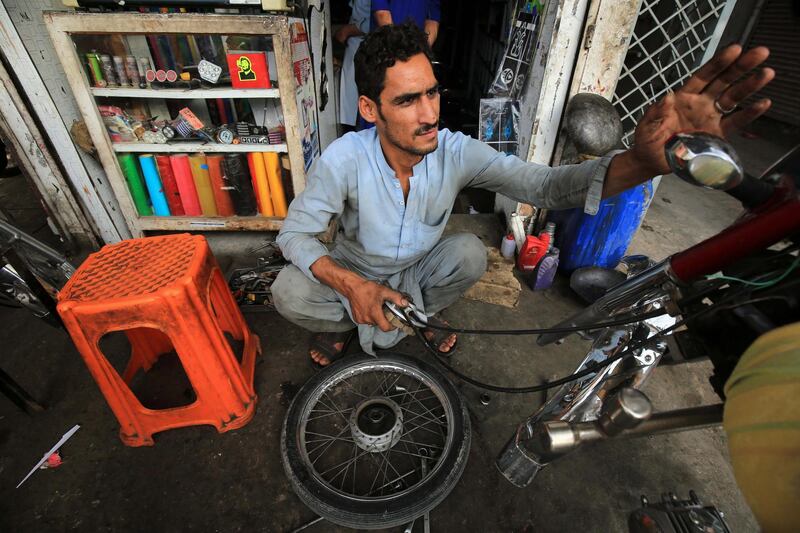Aimal Khan, a 26 year- old Afghan refugee, who is living in Pakistan for years, works at motorcycle repairing workshop on the eve of the in Peshawar, KPK province, Pakistan. Pakistan hosts more than 1.5 million Afghan refugees and has repatriated more than one hundred thousand refugees back to their country in the last two years.  EPA