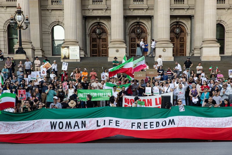 Protesters on the steps of the Victorian Parliament, in Melbourne, Australia, marking the one-year anniversary of Ms Amini's death. EPA