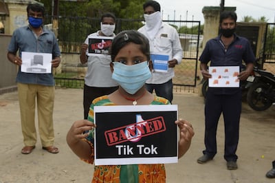 Members of the City Youth Organisation hold posters with the logos of Chinese apps in support of the Indian government for banning the wildly popular video-sharing 'Tik Tok' app, in Hyderabad on June 30, 2020. TikTok on June 30 denied sharing information on Indian users with the Chinese government, after New Delhi banned the wildly popular app citing national security and privacy concerns.
"TikTok continues to comply with all data privacy and security requirements under Indian law and have not shared any information of our users in India with any foreign government, including the Chinese Government," said the company, which is owned by China's ByteDance.
 / AFP / NOAH SEELAM
