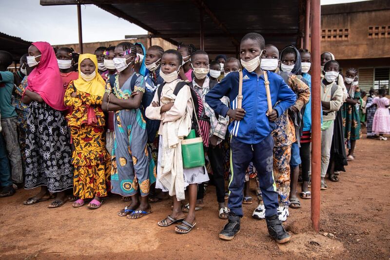 Pupils wait for the opening of their primary school on the first day of the new school year, in Ouagadougou, Burkina Faso. AFP