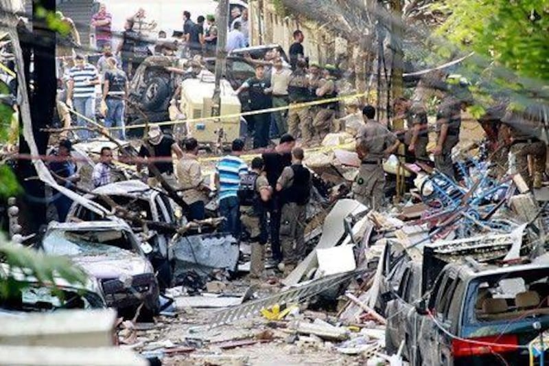 Security forces inspect damages in Beirut's predominantly Christian district of Ashrafieh, a day after a car bomb blast. Anwar Amro / AFP