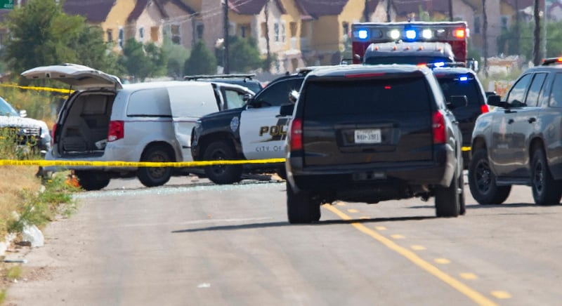 Odessa and Midland police and sheriff's deputies surround a white van in Odessa, Texas, after reports of gunfire. Police said there are "multiple gunshot victims" in West Texas after reports of gunfire on Saturday in the area of Midland and Odessa.  AP