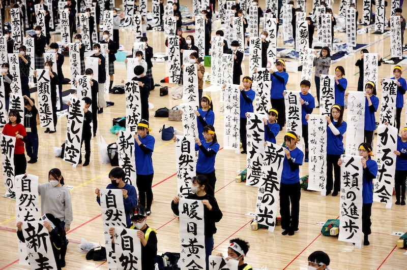 Participants show off their calligraphy at a New Year contest at Nippon Budokan in Tokyo, Japan. Reuters