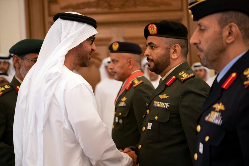 ABU DHABI, UNITED ARAB EMIRATES - April 08, 2019: HH Sheikh Mohamed bin Zayed Al Nahyan, Crown Prince of Abu Dhabi and Deputy Supreme Commander of the UAE Armed Forces (L), presents an Emirates Military Medals to members of the UAE Armed Forces, Ministry of Interior and Abu Dhabi Police, during a Sea Palace barza.
( Ryan Carter for the Ministry of Presidential Affairs )
---