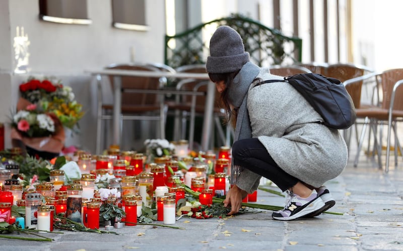 A woman places flowers at the site of the attack in Vienna. Reuters