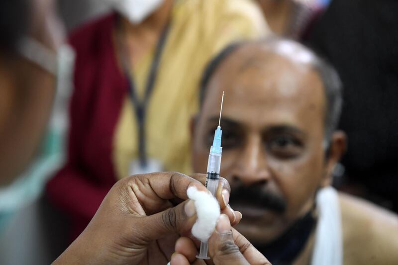 A medical worker prepares to inoculate a doctor with a Covid-19 vaccine at the Urban Primary Health Centre in Kolkata. AFP