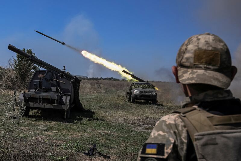 Ukrainian servicemen fire small multiple launch rocket systems towards Russian troops, amid Russia's attack on Ukraine. All photos: Reuters