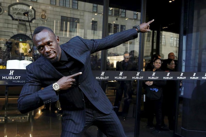 Usain Bolt strikes his signature pose to celebrate the opening of the flagship Hublot store on Fifth Avenue in the Manhattan. Andrew Kelly / Reuters