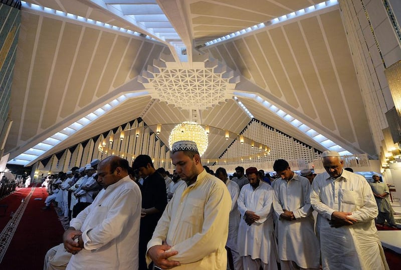 Pakistani Muslims perform a special “Taraweeh” evening prayer on the first day of the Muslim fasting month at the grand Faisal Mosque in Islamabad. Aamir Qureshi/AFP Photo
