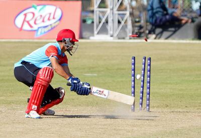 Yasin Patel of Kuwait is bowled at the Mulpani Cricket Ground in Kathmandu. Subas Humagain for The National