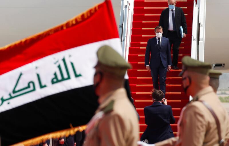 French President Emmanuel Macron arrives at Baghdad airport, Iraq, for his first visit to the country.  AP