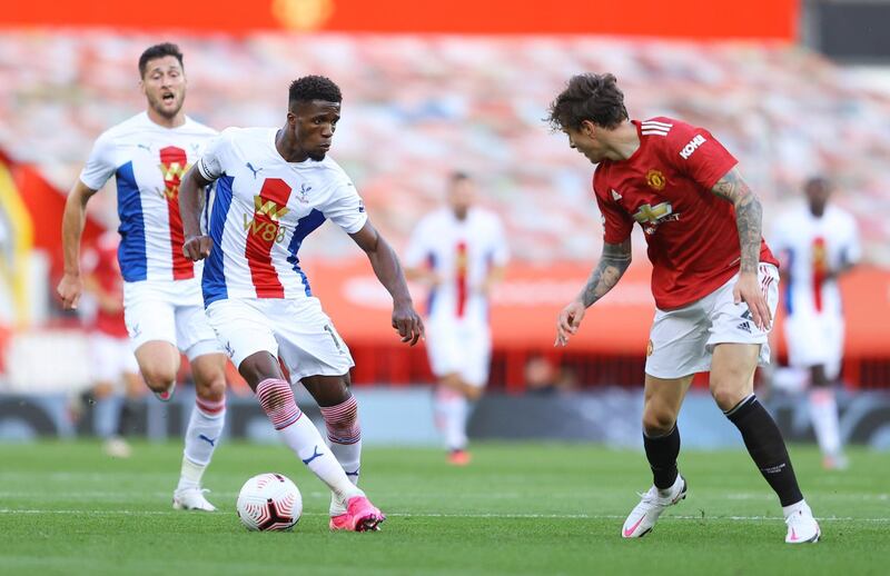 Crystal Palace's Wilfried Zaha runs at United defender Victor Lindelof. Reuters