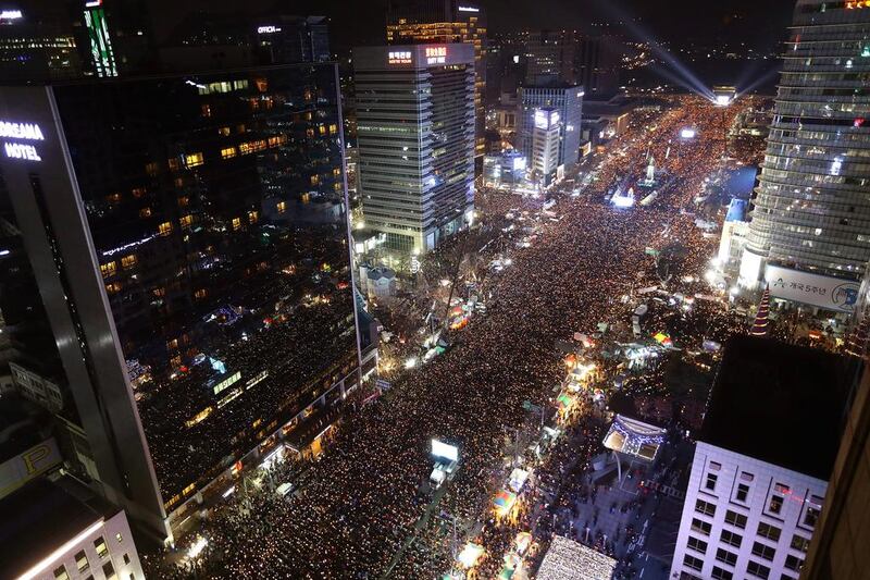 Masses of protesters gather and occupy major streets in central Seoul for a rally against South Korean president Park Geun-hye. Chung Sung-jun /Getty Images