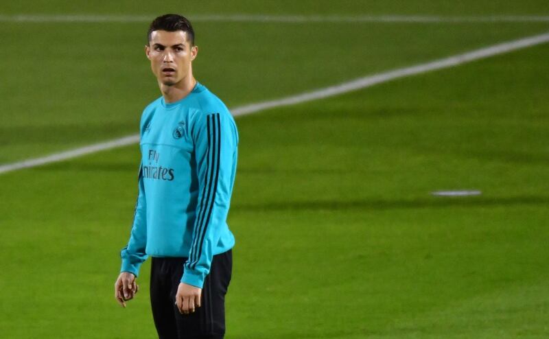 Real Madrid's Portuguese forward Cristiano Ronaldo stands on the pitch during a training session two days prior to their FIFA Club World Cup semi-final match at New York University Abu Dhabi's stadium in the Emirati capital on December 11, 2017. / AFP PHOTO / GIUSEPPE CACACE