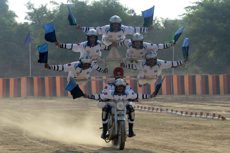 Indian army soldiers from the Dare Devil team perform on September 16, 2016, for 75th anniversary of the 8th Mechanised Infantry (7 Punjab) at Khasa, some 15 kilometres from Amritsar. The battalion was raised on May 5, 1941, and took part in the Burma campaign of the Second World War, as well as all major operations post-independence. Narinder Nanu / Agence France-Presse